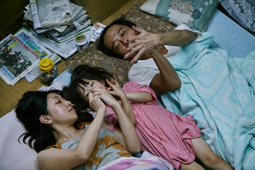 Colour still of Ando Sakura, Sasaki Miyu, Lily Franky in 2018 film Shoplifters.