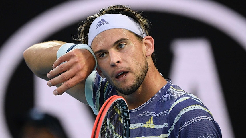 Dominic Thiem wipes his brow during the Australian Open final