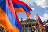 Armenian activists wave flags outside the German Bundestag after law makers voted to recognise the Armenian genocide.