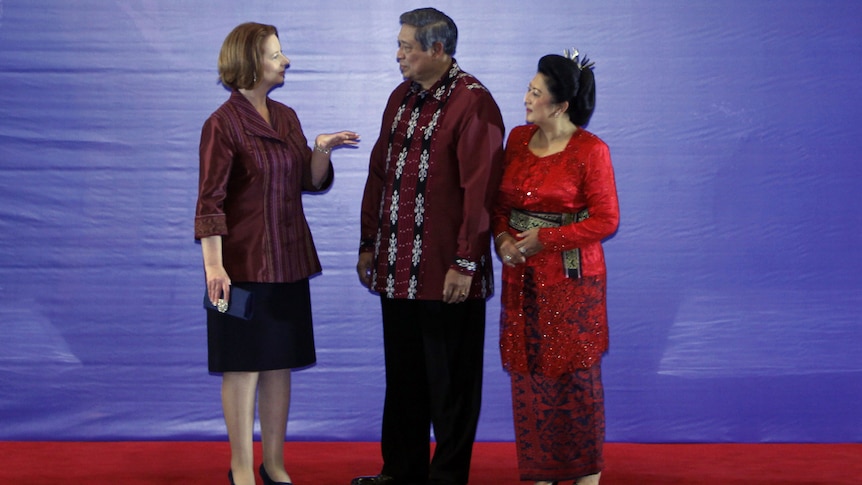 Prime Minister Julia Gillard is greeted by Indonesian president Susilo Bambang Yudhoyono and his wife Kristiani Yudhoyono