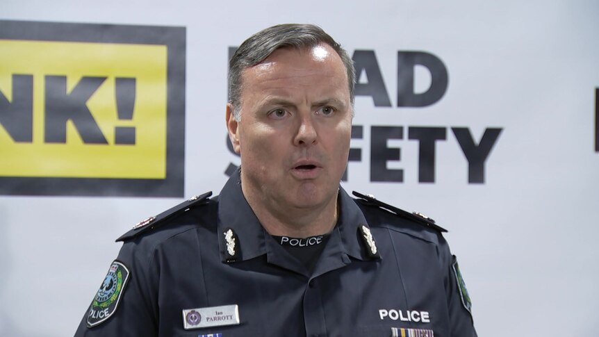 A man in a police uniform speaking