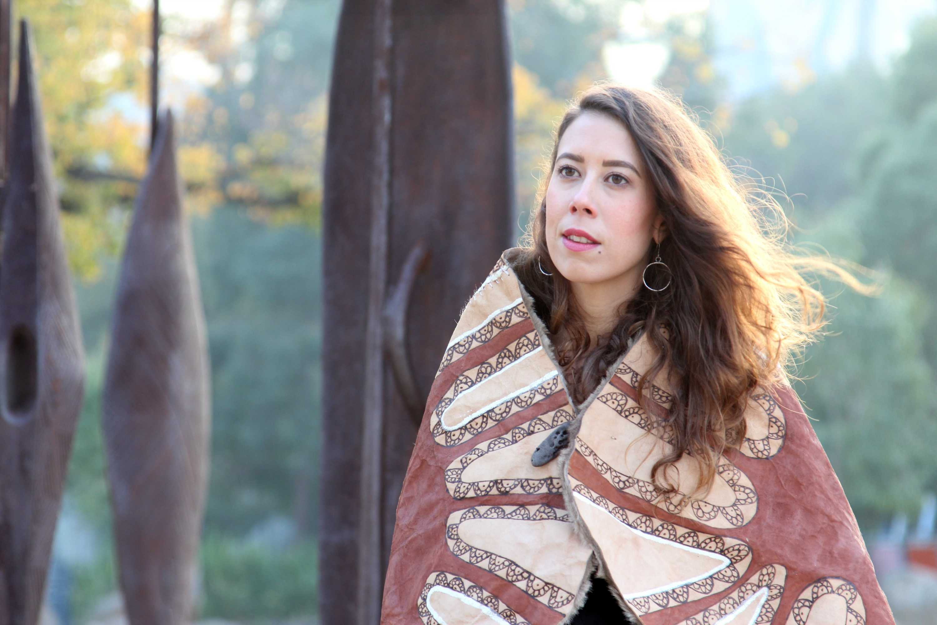 Kimberley Moulton wears a wallaby fur cloak, symbolising the bogong moth.