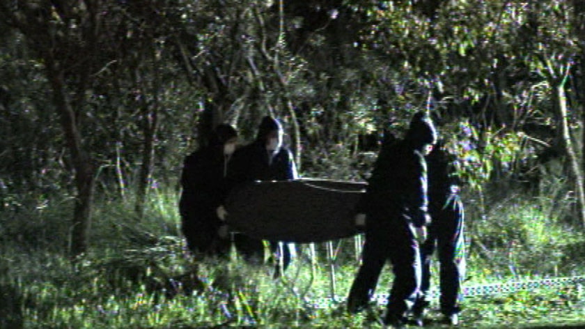 Forensic police at the grave site in Kings Park.