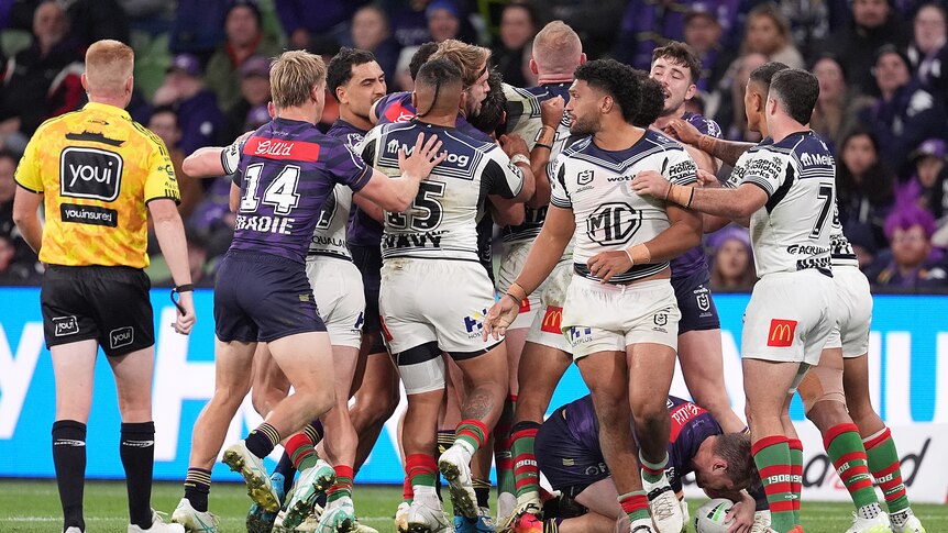 Melbourne Storm and South Sydney Rabbitohs players tussle after Taane Milne's ugly tackle on Cameron Munster.