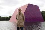 Artist Christo stands in front of his work The London Mastaba.