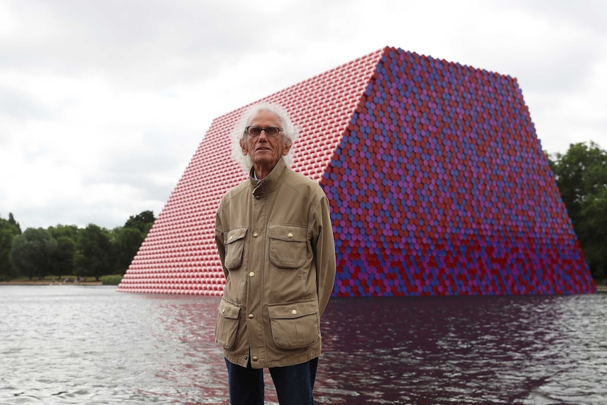 Artist Christo stands in front of his work The London Mastaba.