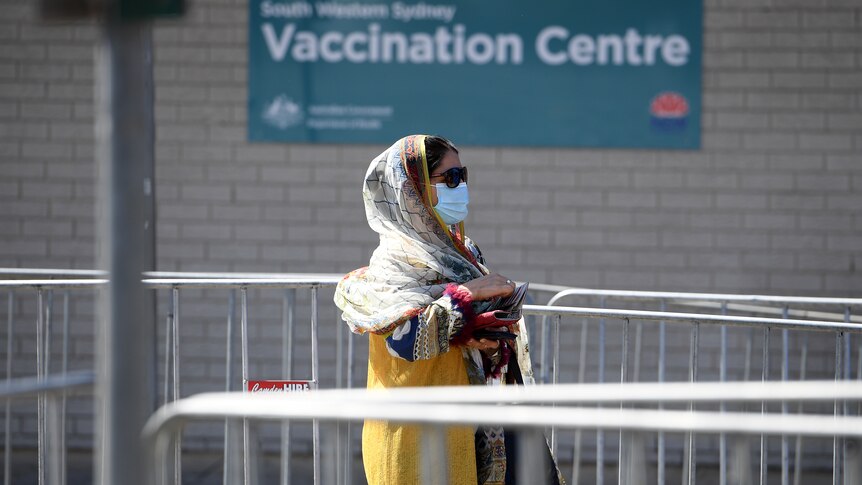 Woman in line at Sydney vaccination centre