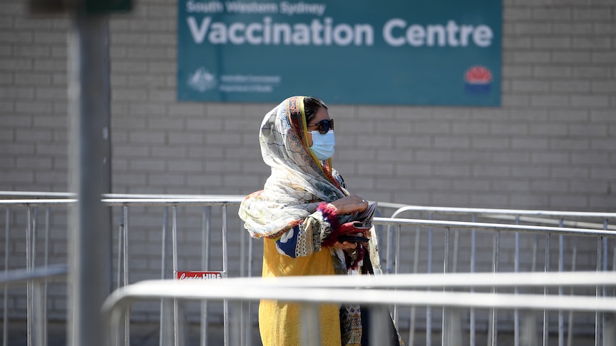 Woman in line at Sydney vaccination centre