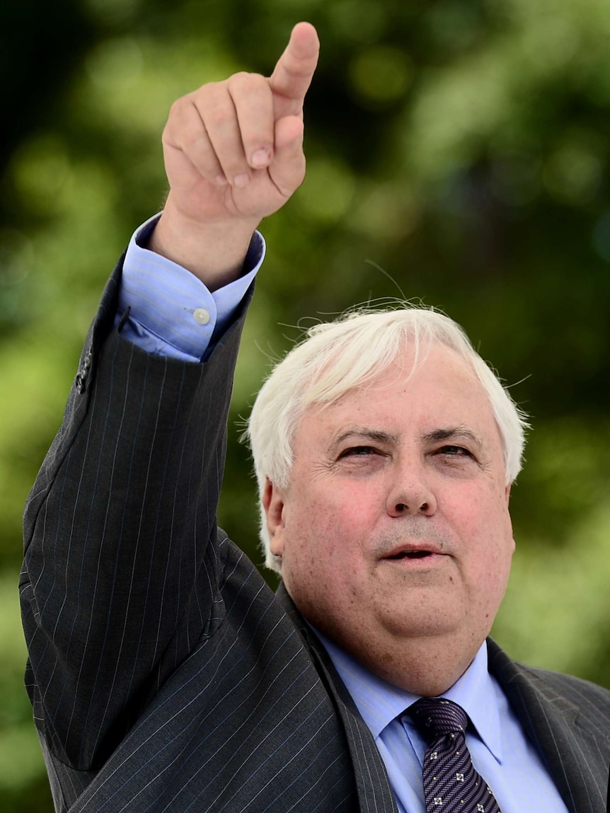 Mining magnate Clive Palmer gestures to students during a lecture at Bond University on the Gold Coast.