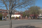 A line of people waiting for COVID testing on the street in Temora 