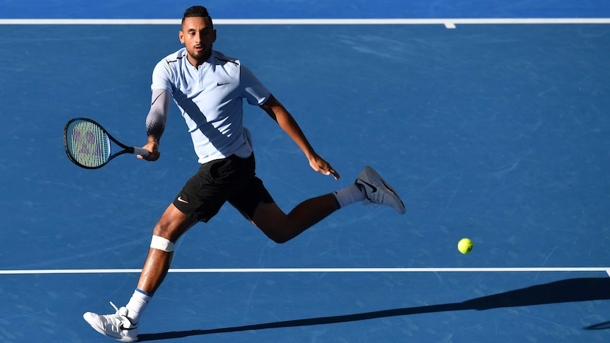 Nick Kyrgios plays a forehand on the run in the Brisbane International