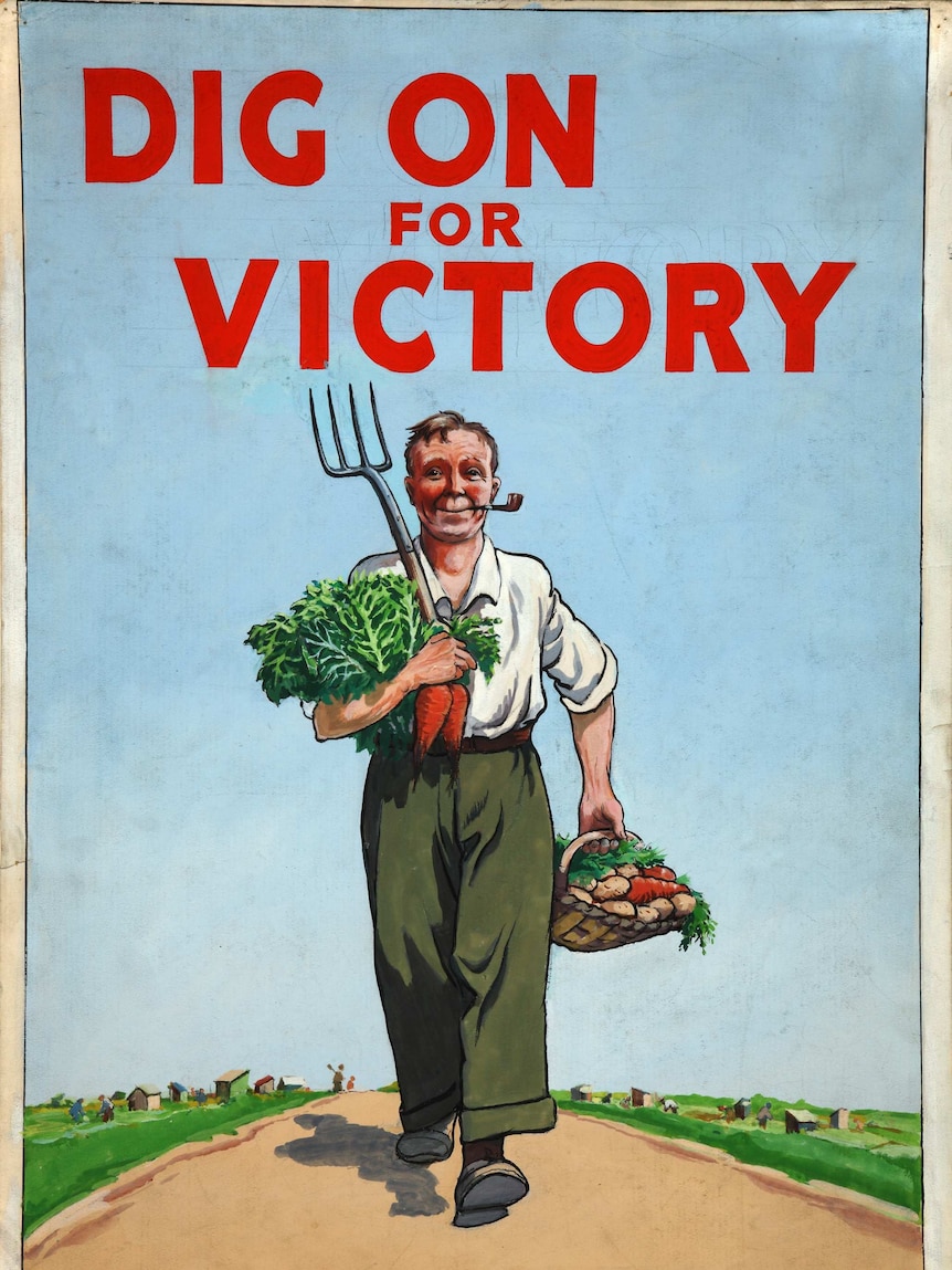 A man carries vegetables and a pitch fork below red lettering reading "dig on for victory"