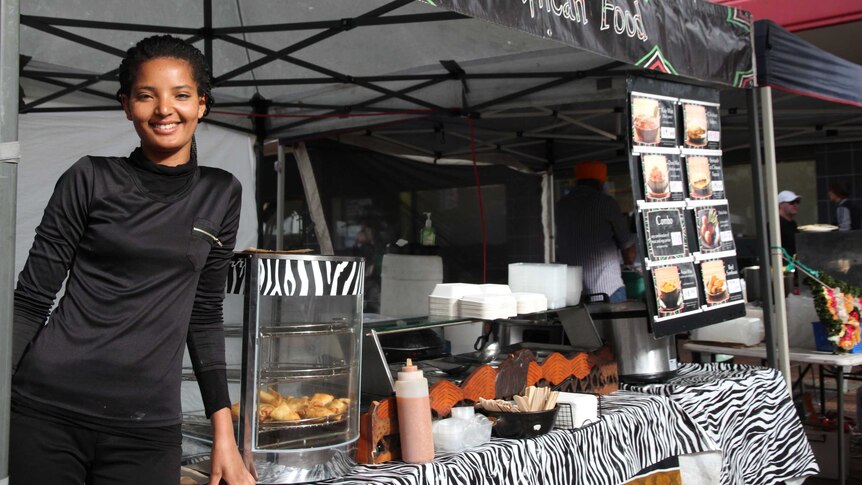 A woman at a market stall