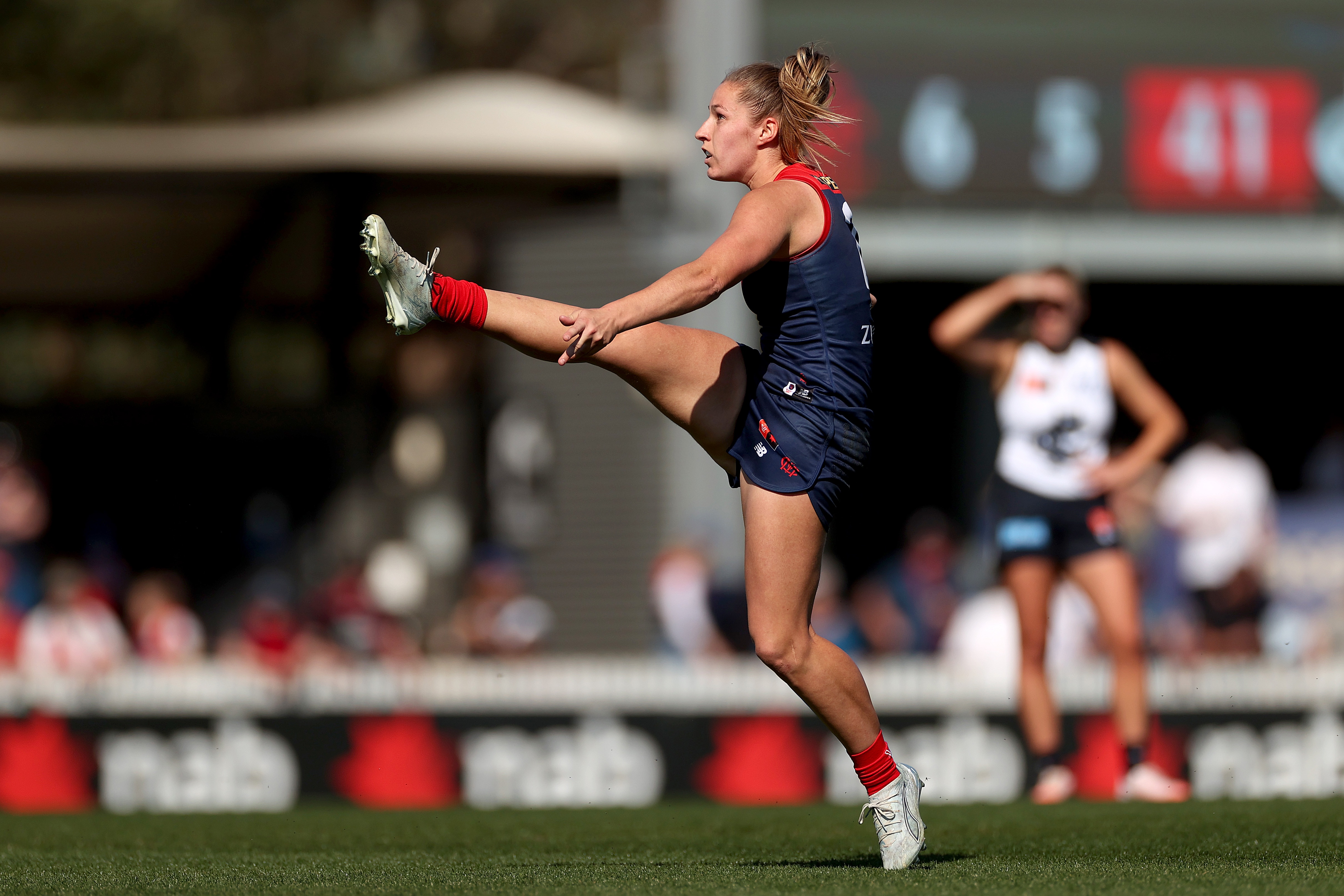 Demons claim top spot as Cats maintain winning ways