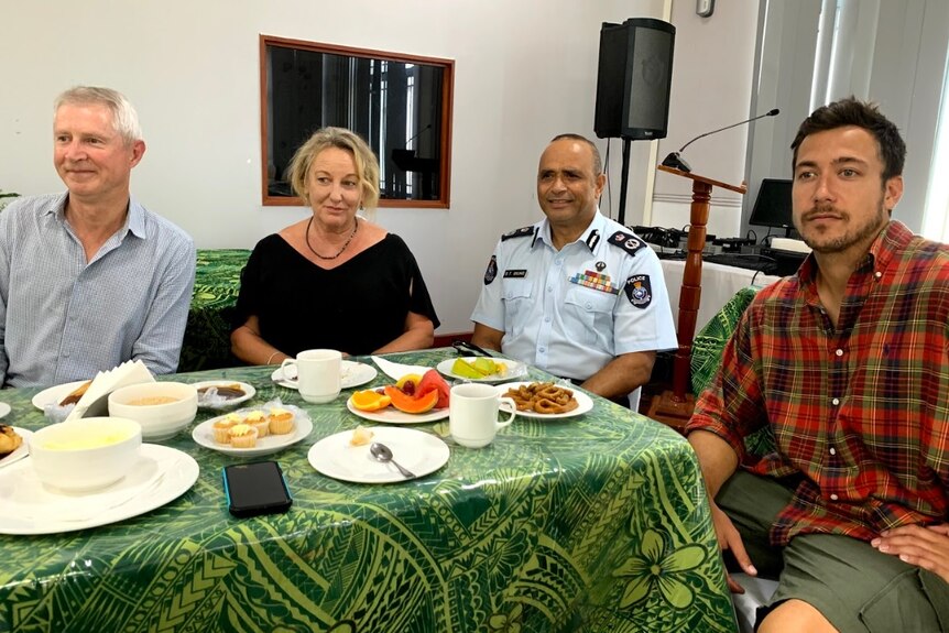 Mark Jennings, Melanie Reid and Hayden Aull pictured with Sitiveni Qiliho at a table for morning tea.