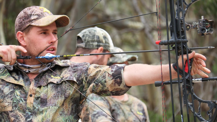 Zach Slattery takes aim with his compound bow on Kangaroo Island.