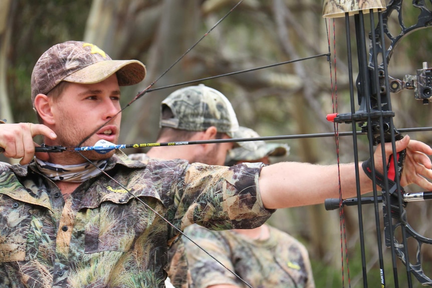 Zach Slattery takes aim with his compound bow on Kangaroo Island.