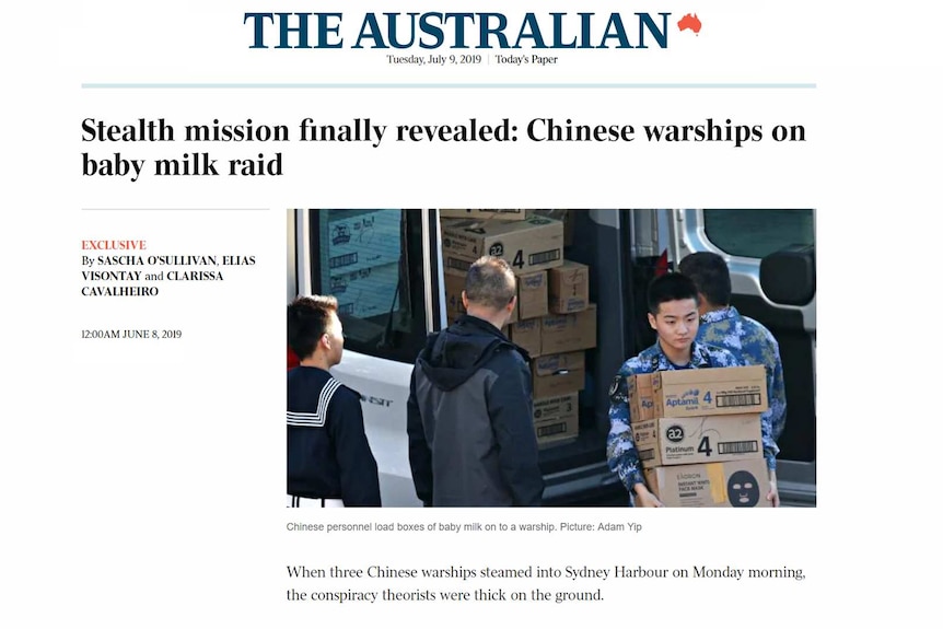 Chinese military personnel loading boxes of baby milk on to a warship.