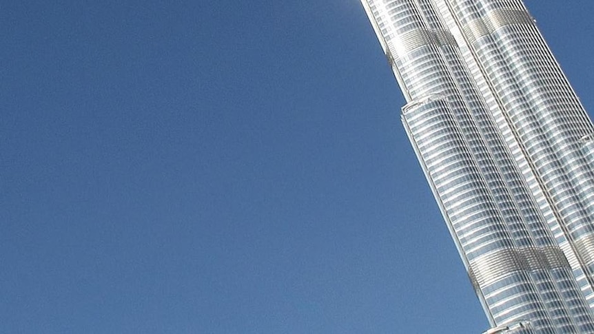 Emirati men take photos of Burj Dubai