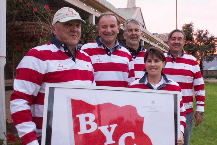 Members of the Boulder Yacht Club stand outside the historic Hannans Club in Kalgoorlie