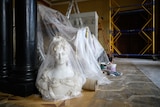 A bubble-wrapped marble bust waits with a small selection of relics to be moved