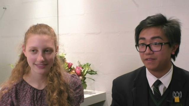 Two teenage students sit for interview