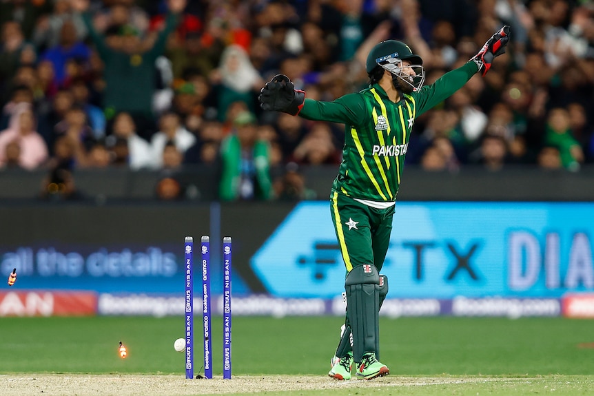 Mohammad Rizwan wheels away in disgust as the stumps have broken