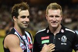 Collingwood's Steele Sidebottom and coach Nathan Buckley (R) after the Magpies' win over Essendon.