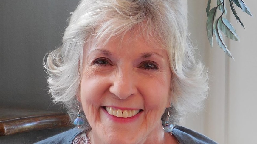 A portrait shot of Sue Grafton smiling.