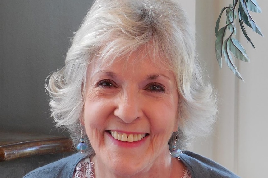 A portrait shot of Sue Grafton smiling.