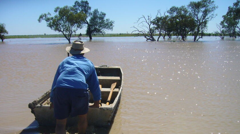 Nedgera Creek overflows flooding a driveway on a property north-west of Coonamble in western NSW on December 24, 2007.