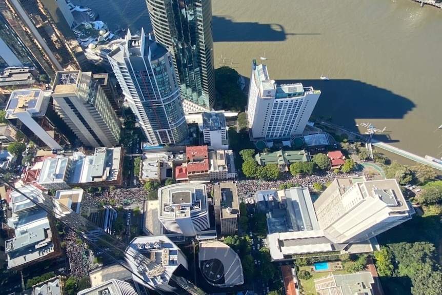 Drone image over Brisbane city revealing thousands of people on the streets.