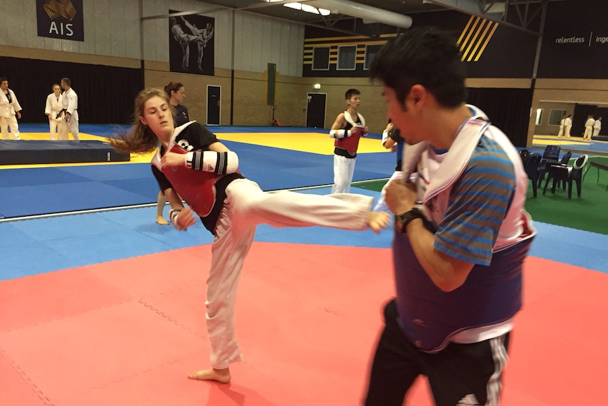 Hopefuls at the AIS combat sport draft selection camp train in taekwondo in Canberra.