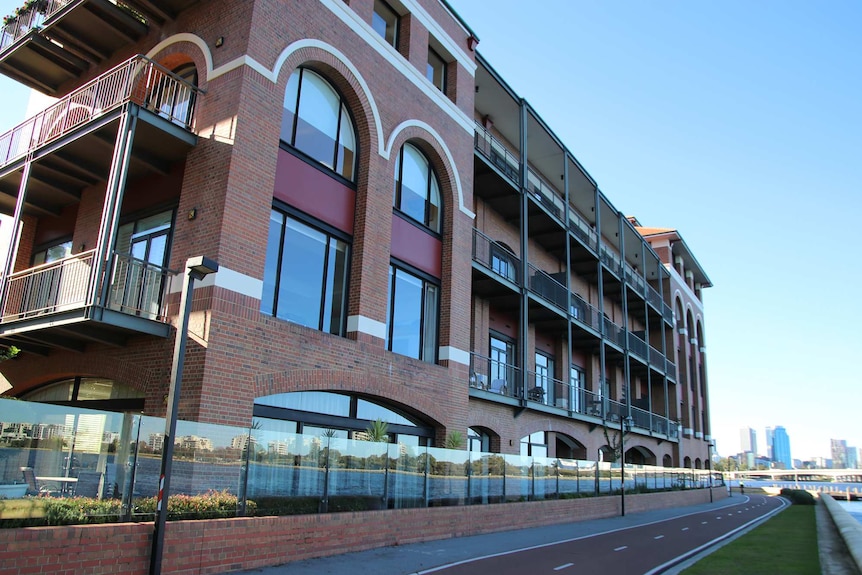 An angled wide shot of the Old Swan Brewery brick building in Perth from the Swan River side.