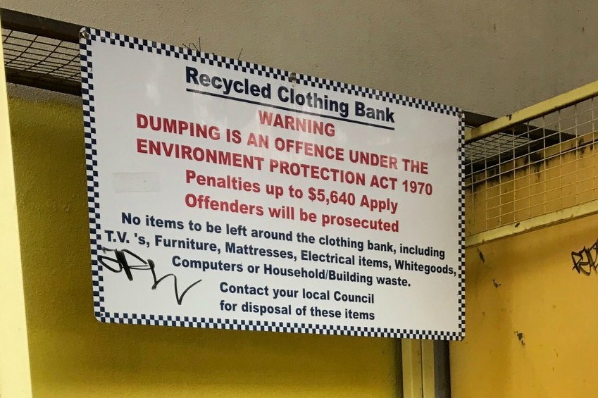 A sign warns against illegal dumping noting "it is an offence under the Environmental Protection Act".