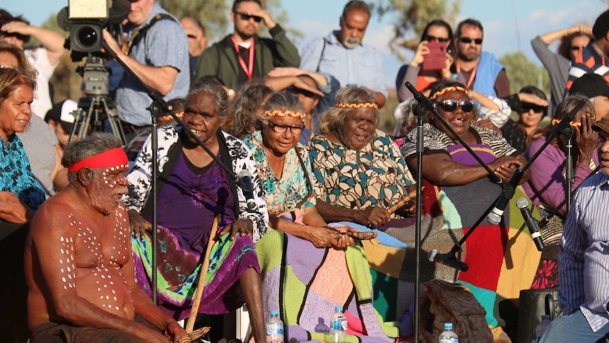Indigenous women sing at the closing ceremony of the talks at Uluru.