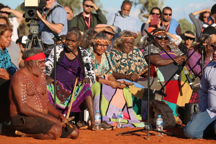 Indigenous women sing at the closing ceremony of the talks at Uluru.