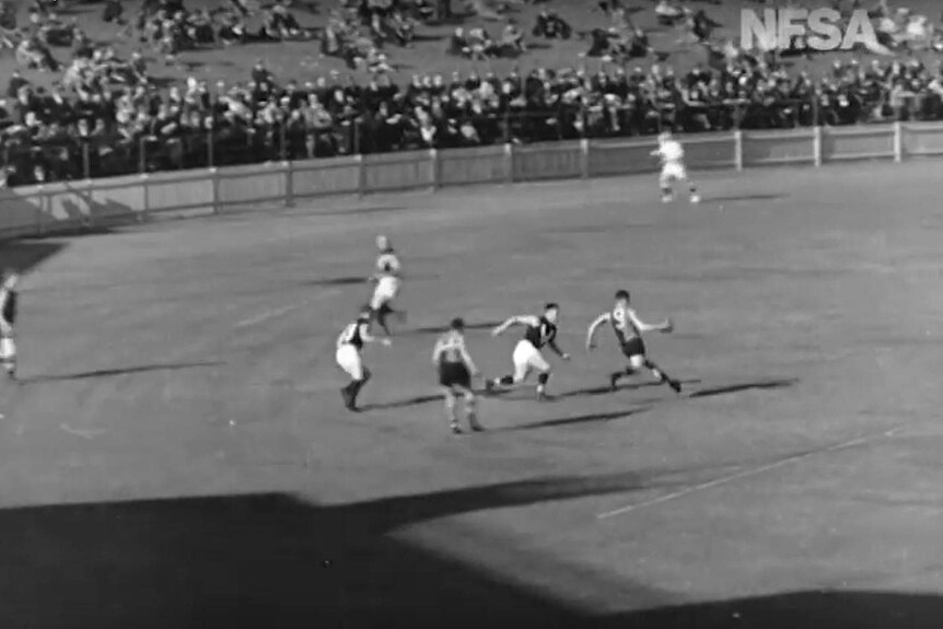 Ken Farmer kicks for goal in 1933