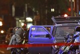 Failed bomb: A NYPD bombsquad officer examines a sport utility vehicle parked in Times Square