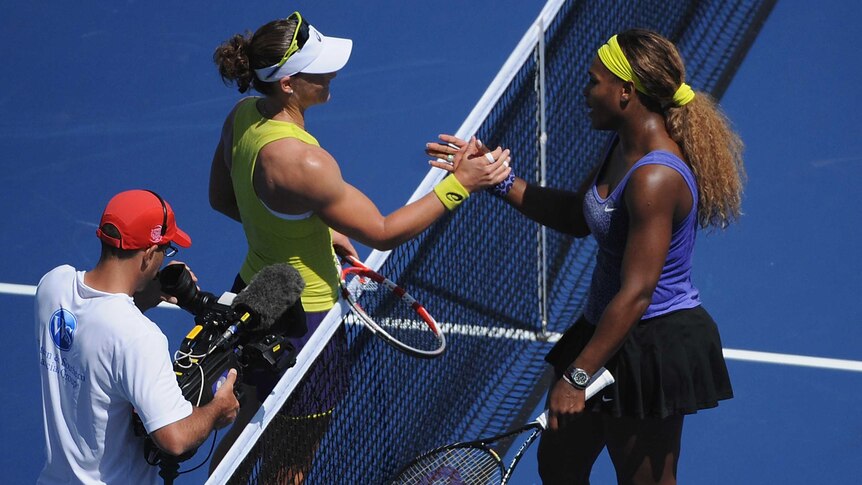 Samantha Stosur shakes hands with Serena Williams in Cincinnati