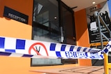 Police tape at the entry to the Roma Street City Backpackers Hostel in Brisbane