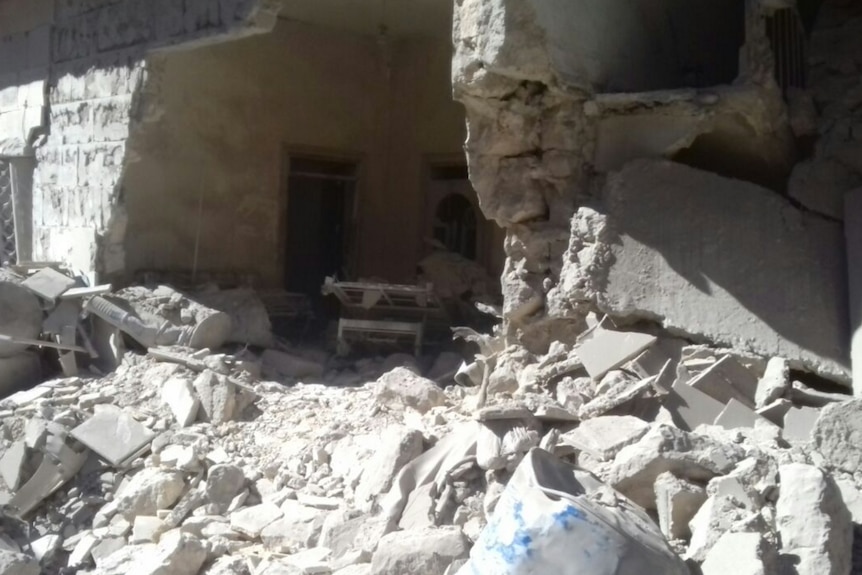 Concrete rubble covers the area where the hospital wall was blown up