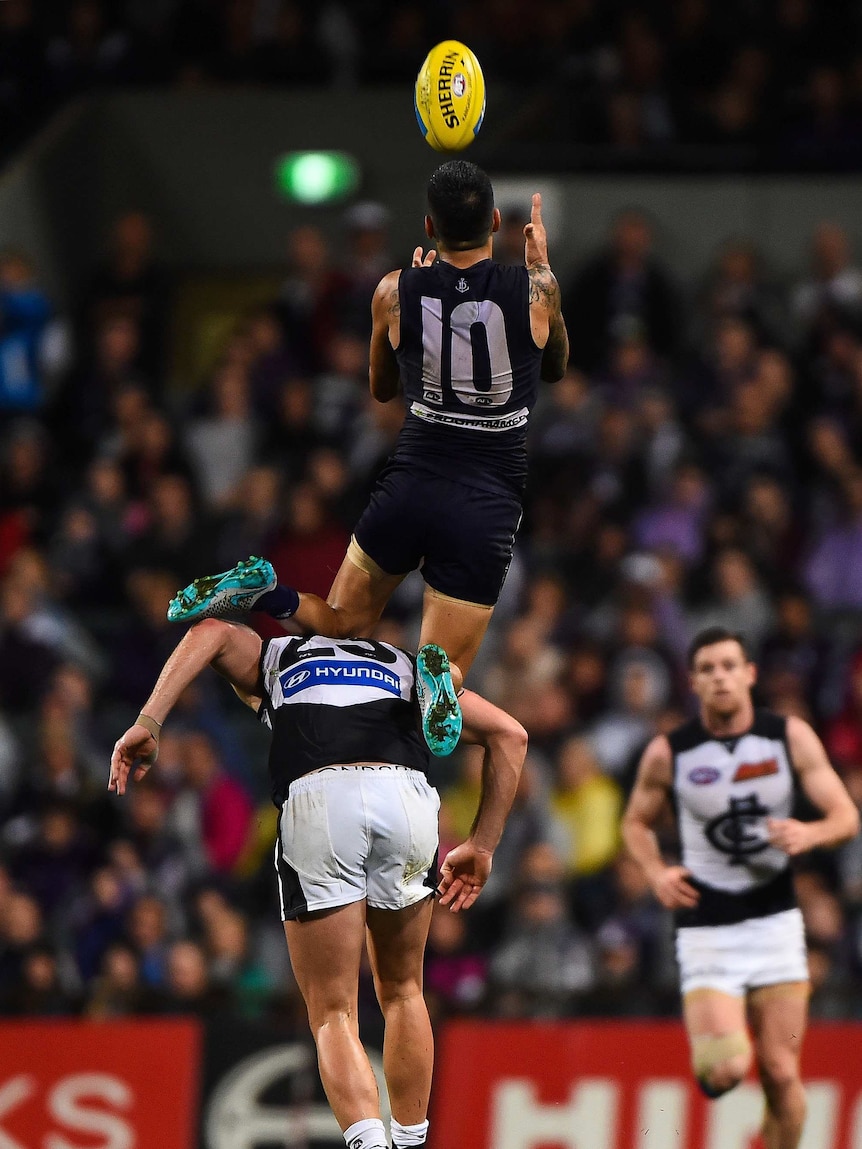 Michael Walters flies high for a mark for the Dockers against Carlton at Subiaco Oval.