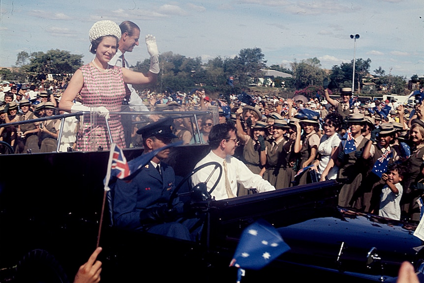 Queen Elizabeth II and the Duke of Edinburgh greeting children in 1970.