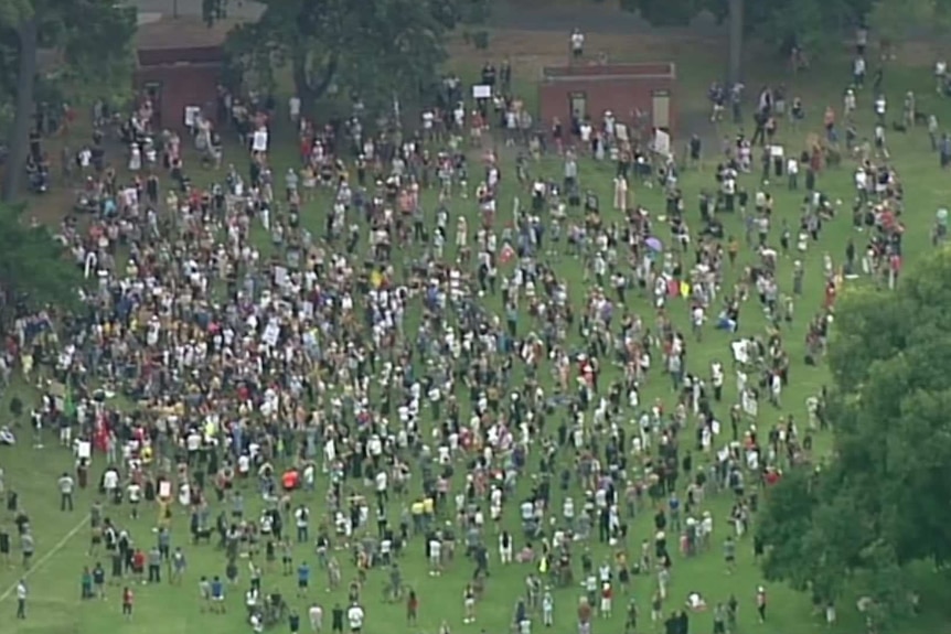 An overhead photo of a crowd of people in a park in Melbourne.