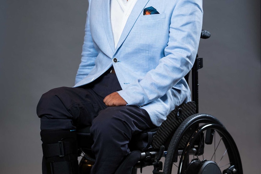 Dr Dinesh Palipana sits in his wheelchair.