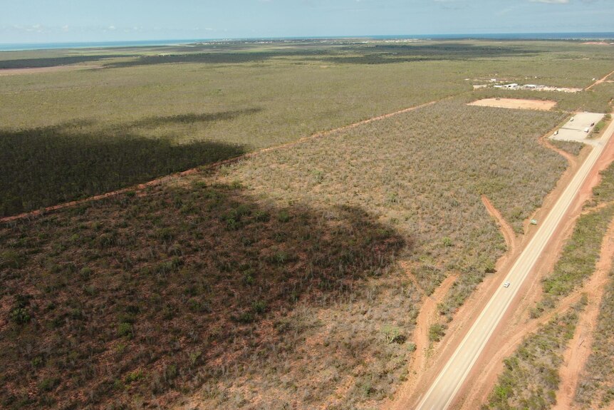 An aerial view of bush and shadows from clouds