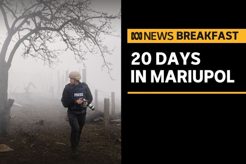 20 Days in Mariupol: Press photographer walks through foggy streetscape with camera