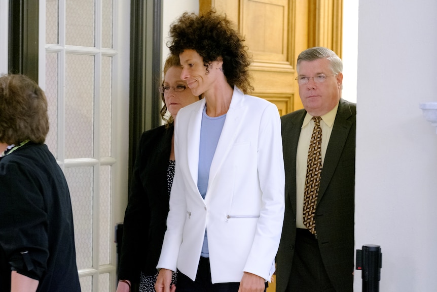 Andrea Constand walks out of the courtroom.