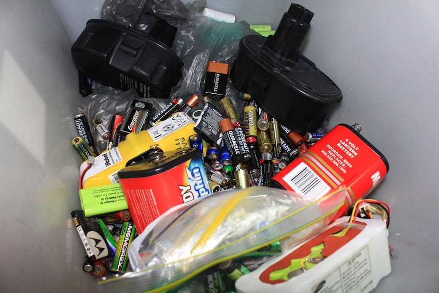 Different types of batteries in a recycling box
